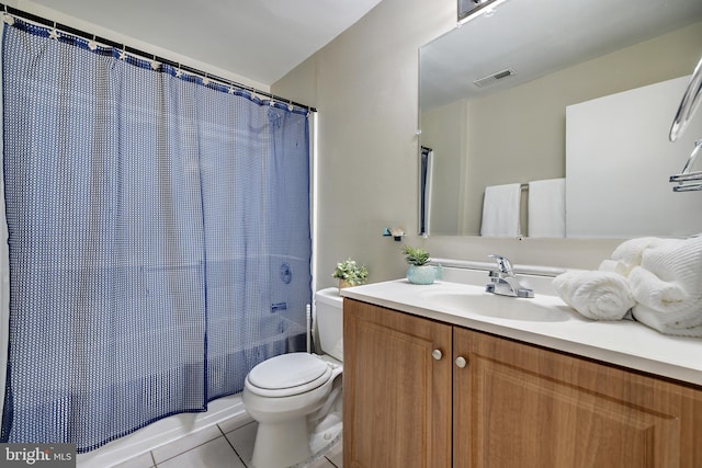 full bathroom featuring tile patterned flooring, vanity, shower / tub combo, and toilet