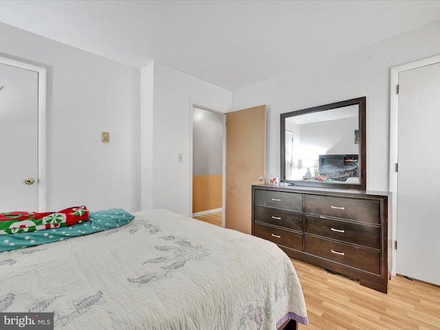 bedroom featuring light wood-style flooring