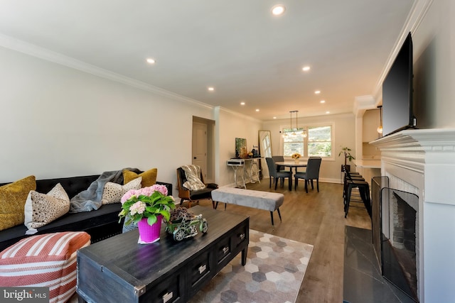 living room featuring hardwood / wood-style flooring and ornamental molding