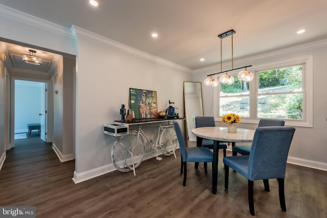 dining room with ornamental molding and dark hardwood / wood-style flooring