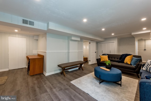 living room featuring dark wood-type flooring