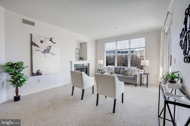 carpeted living room with crown molding and a high end fireplace