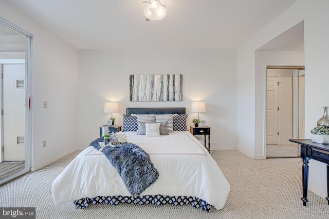 bedroom featuring light carpet