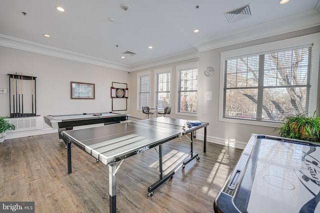 playroom with crown molding and light hardwood / wood-style flooring