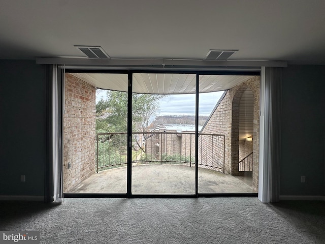 interior space featuring a wall of windows