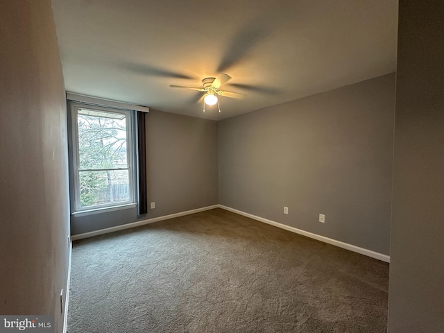 carpeted empty room featuring ceiling fan