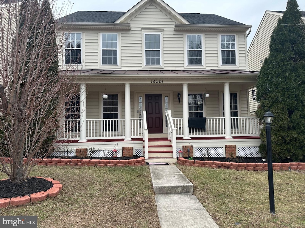 view of front of home with a front lawn and a porch