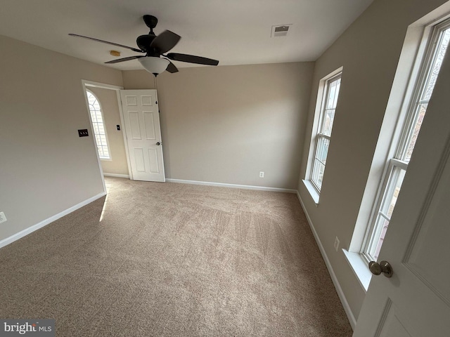 carpeted empty room with ceiling fan