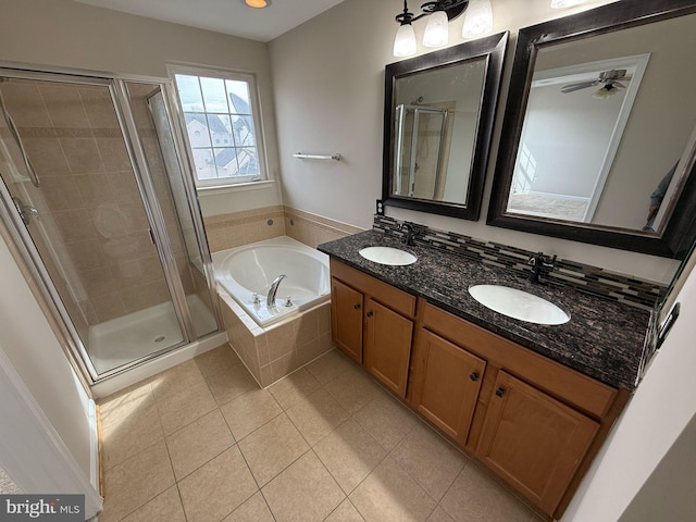 bathroom featuring separate shower and tub, vanity, and tile patterned floors