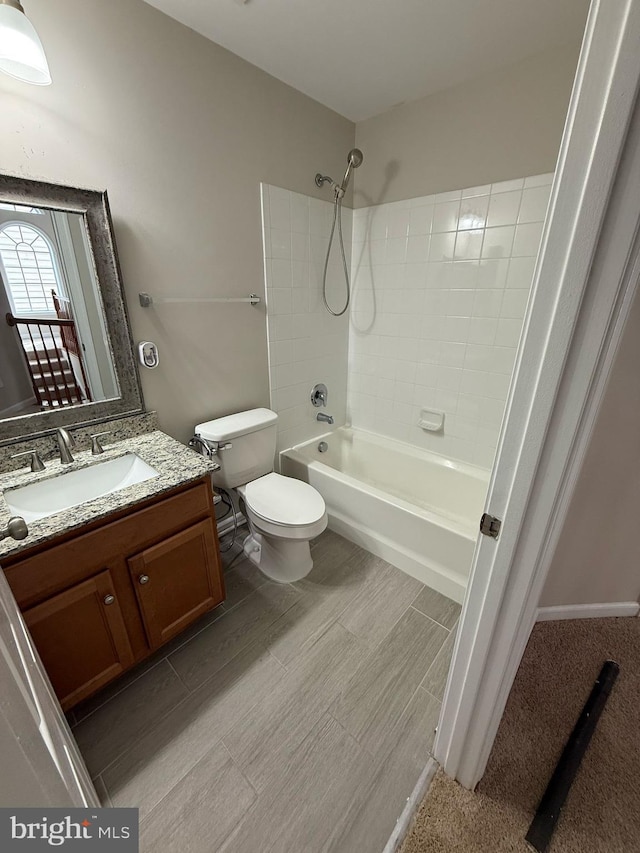 full bathroom with tiled shower / bath combo, vanity, and toilet