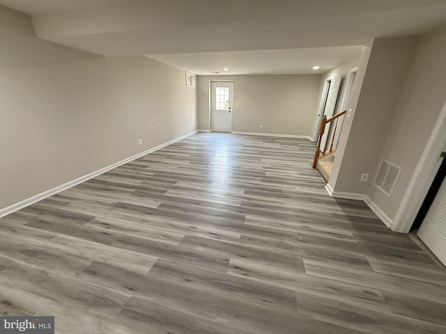 empty room with light hardwood / wood-style flooring