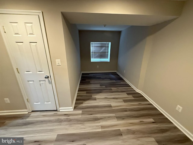 corridor featuring hardwood / wood-style floors