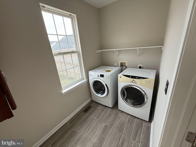 washroom with separate washer and dryer