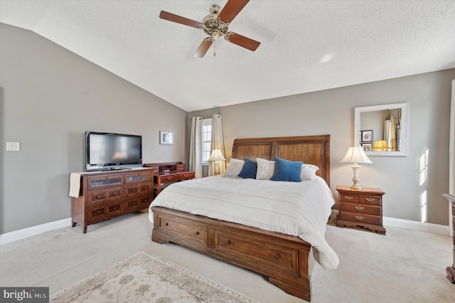 bedroom featuring lofted ceiling, light carpet, and baseboards