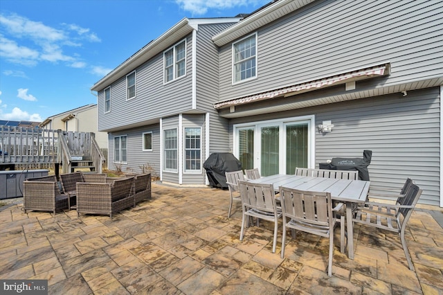 view of patio with a grill and outdoor dining space