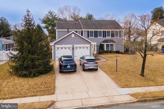 view of front of house with concrete driveway and an attached garage