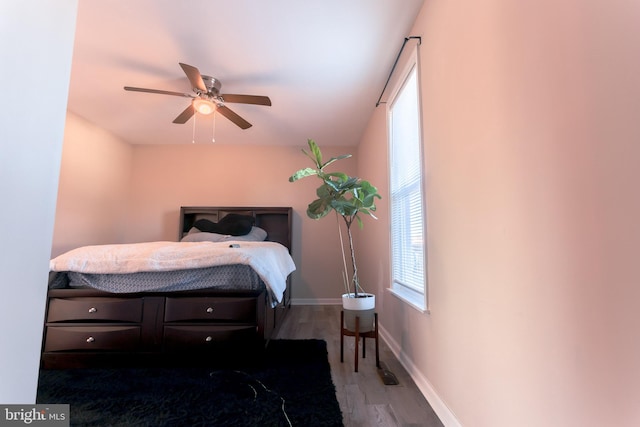 bedroom featuring hardwood / wood-style flooring and ceiling fan