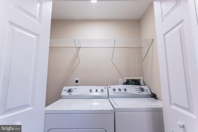 laundry area featuring independent washer and dryer