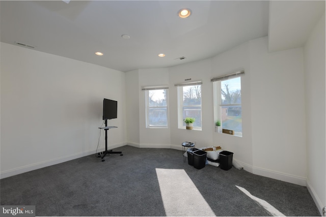 exercise area with dark colored carpet