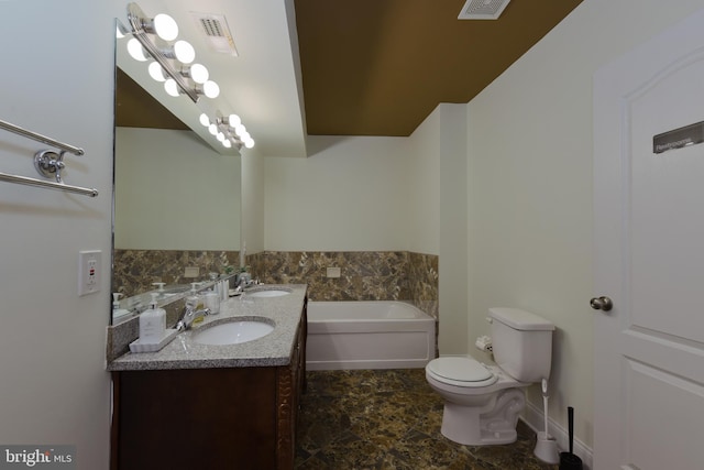 bathroom with a bathing tub, vanity, and toilet