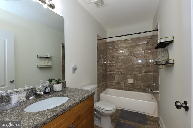 full bathroom featuring vanity, toilet, and tiled shower / bath combo