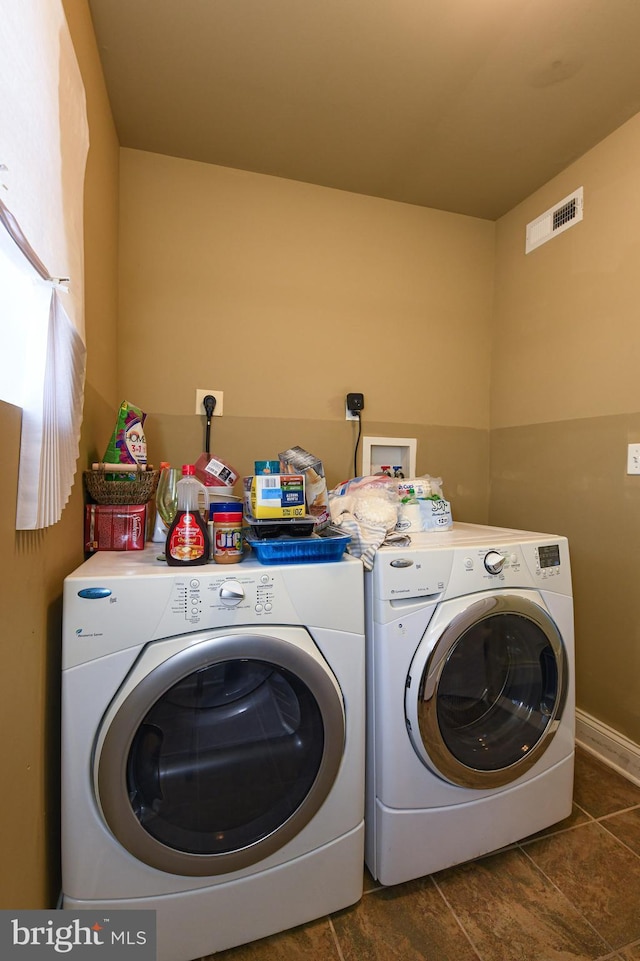 laundry room with independent washer and dryer