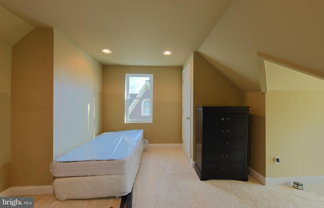 bedroom featuring light carpet