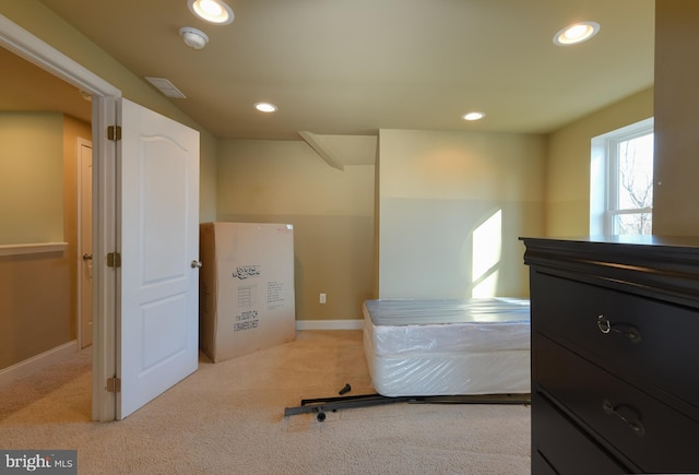 bedroom featuring light colored carpet