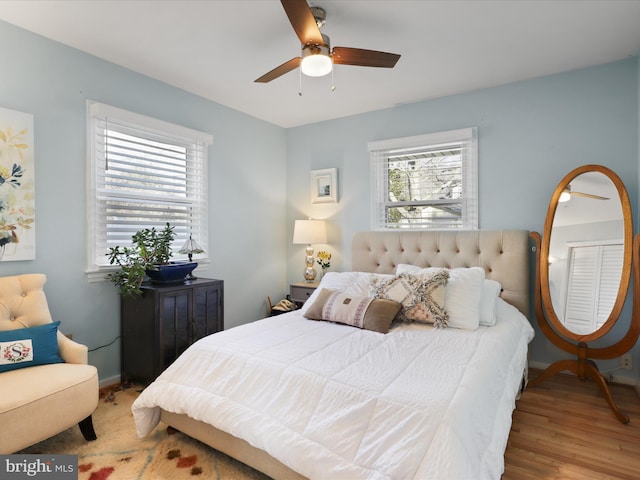 bedroom featuring hardwood / wood-style flooring and ceiling fan