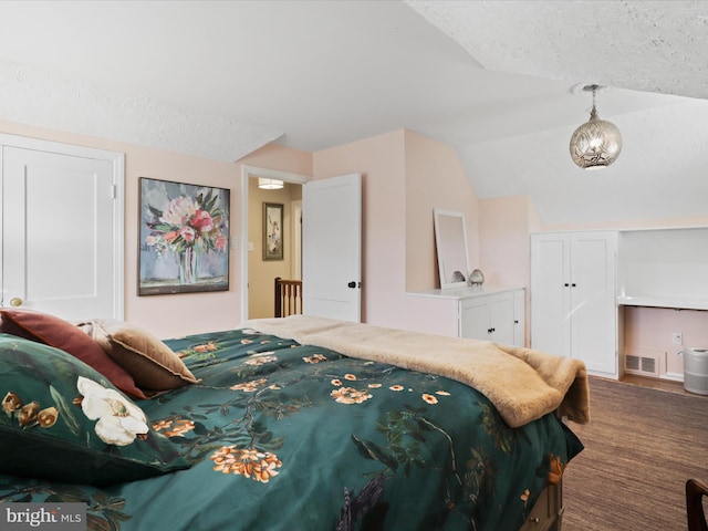 bedroom featuring lofted ceiling