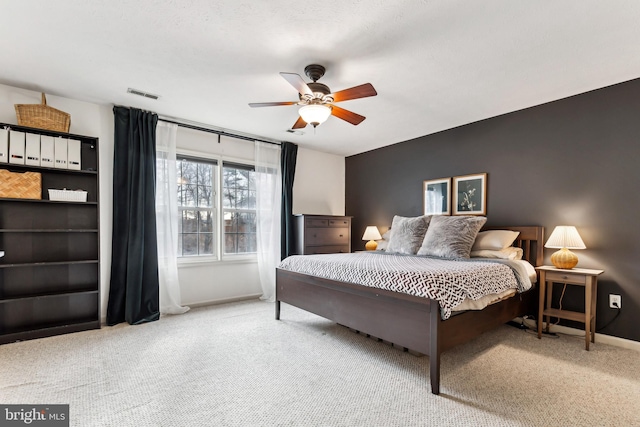 bedroom featuring ceiling fan and carpet flooring