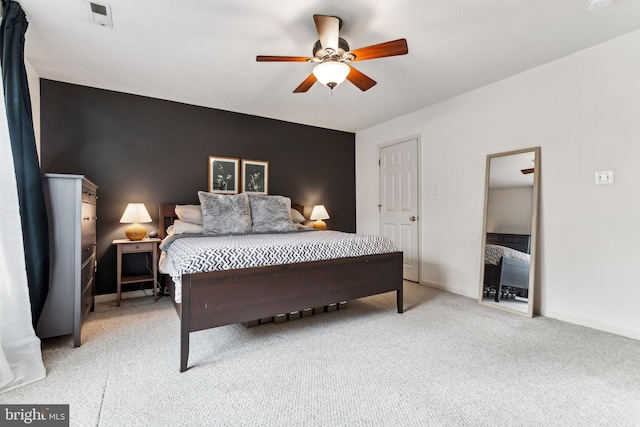 bedroom featuring ceiling fan and light carpet