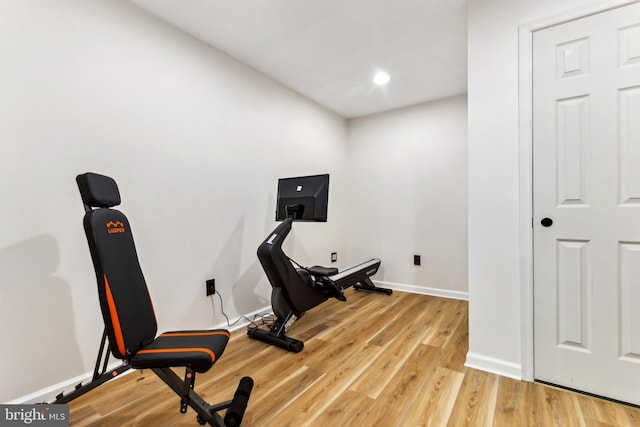 exercise area featuring light hardwood / wood-style floors