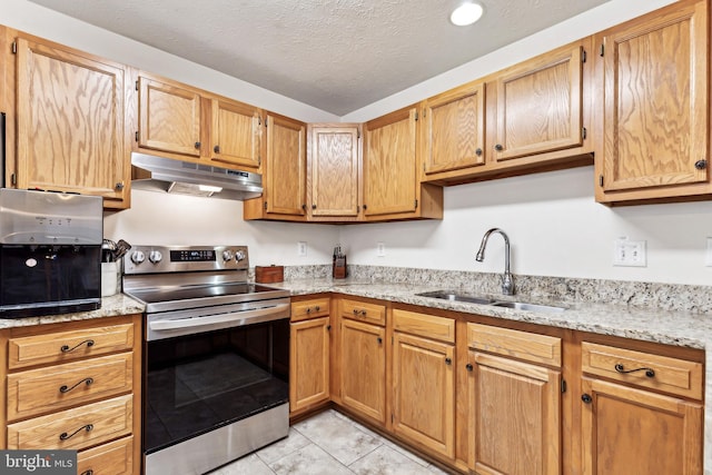 kitchen featuring sink, a textured ceiling, light stone counters, and stainless steel range with electric stovetop