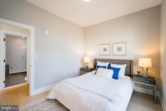 bedroom with light wood-type flooring