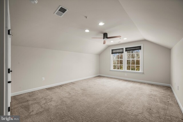 bonus room with ceiling fan, vaulted ceiling, and carpet