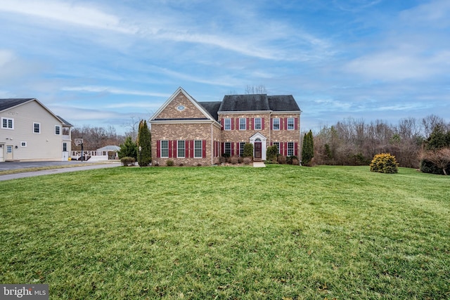 view of front of home with a front lawn