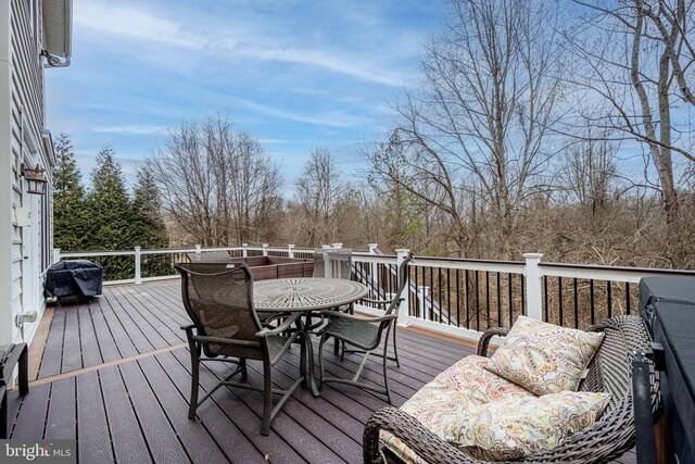 wooden terrace featuring area for grilling