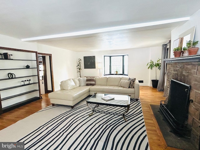 living room featuring a fireplace and wood-type flooring