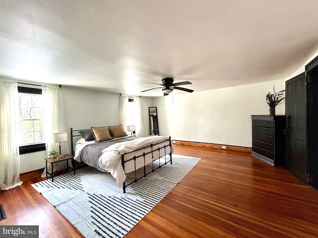 bedroom featuring dark hardwood / wood-style floors and ceiling fan