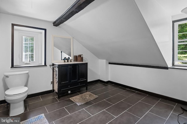 bonus room with sink, lofted ceiling with beams, and dark tile patterned floors