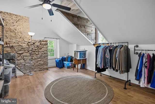 bonus room with hardwood / wood-style flooring, vaulted ceiling, and ceiling fan