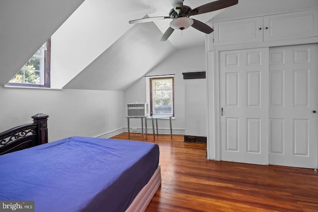 bedroom featuring hardwood / wood-style flooring, ceiling fan, lofted ceiling, and a closet