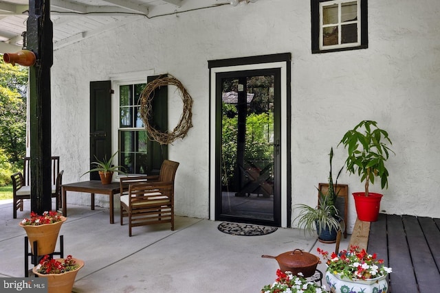 doorway to property with a patio