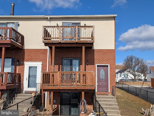 back of house with a balcony