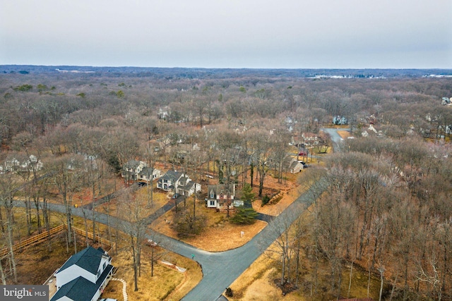 bird's eye view featuring a forest view