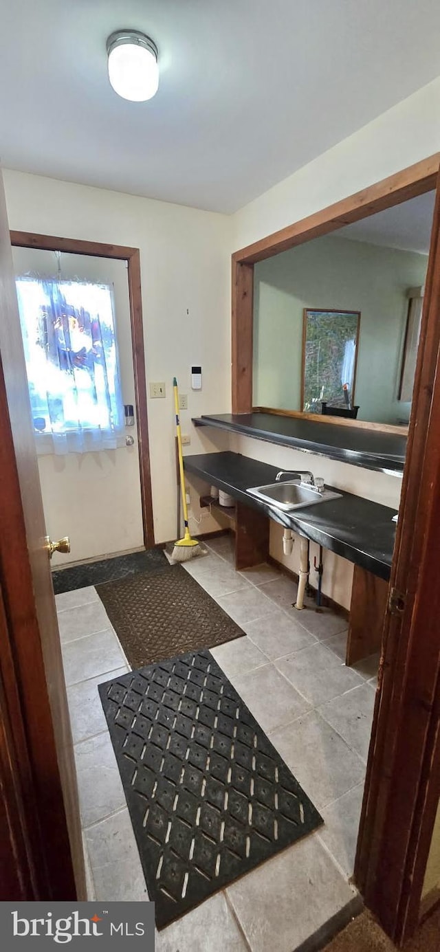 bathroom with tile patterned floors and sink