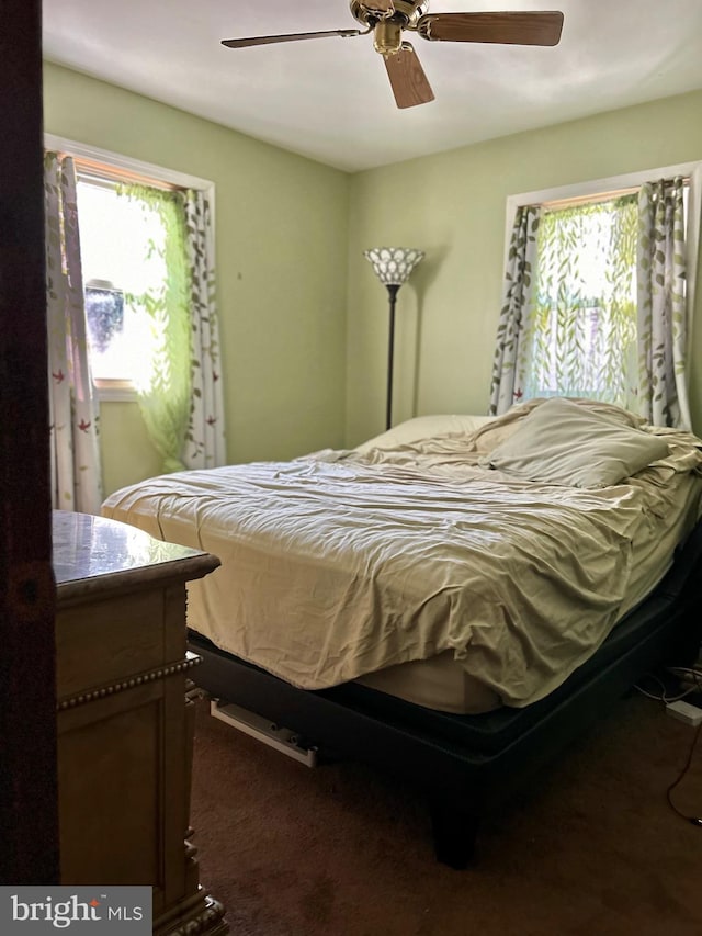 carpeted bedroom featuring ceiling fan