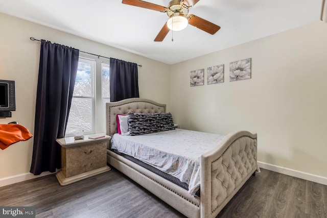 bedroom featuring dark wood-type flooring and ceiling fan