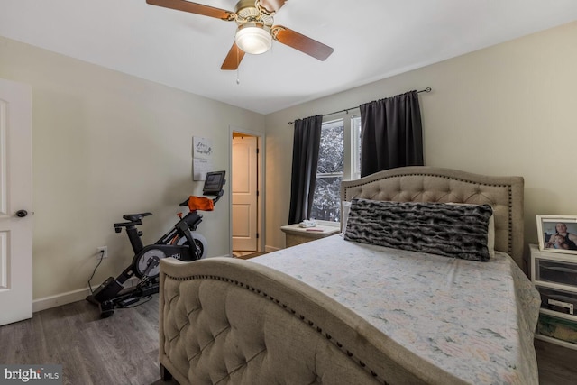 bedroom featuring hardwood / wood-style flooring and ceiling fan